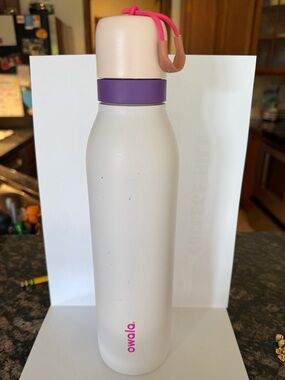 Owala Cream Insulated Water Bottle with Purple Collar and Pink Accents